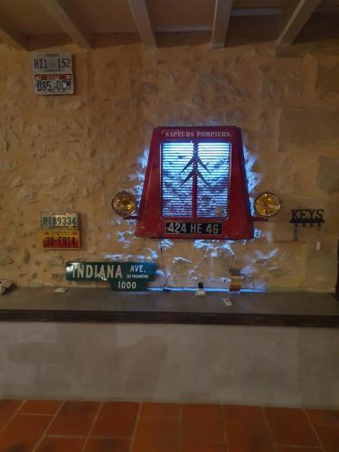a window in a room with signs on a wall at exceptionnel loft style industriel tout équipé 15 personnes avec piscine et jacuzzi in Villebramar