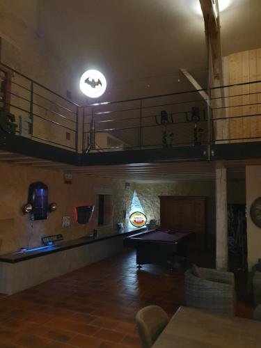 a room with a ping pong table in a building at exceptionnel loft style industriel tout équipé 15 personnes avec piscine et jacuzzi in Villebramar
