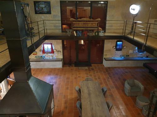 an overhead view of a room with a wooden table at exceptionnel loft style industriel tout équipé 15 personnes avec piscine et jacuzzi in Villebramar