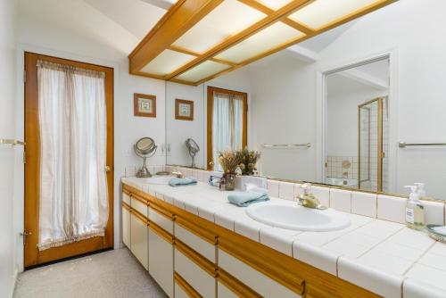 a bathroom with a sink and a mirror at 1965 Benson in Cambria