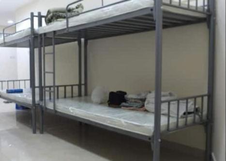 a couple of bunk beds in a room at Sharjah for travelers in Sharjah
