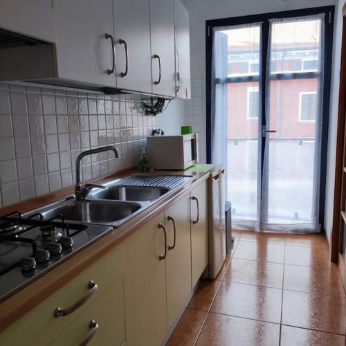 a kitchen with a sink and a counter top at lL NIDO IN CITTÀ in Trento