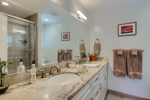a bathroom with two sinks and a large mirror at 5398 Nottingham in Cambria