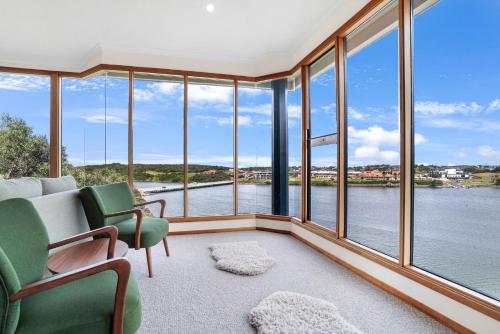 a living room with a view of the water at Riverview in Warrnambool