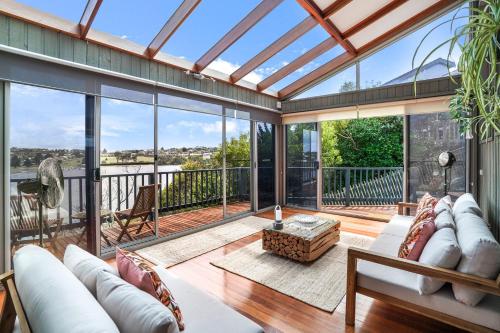an open living room with a large glass ceiling at Riverview in Warrnambool
