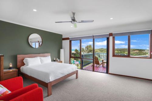 a bedroom with a bed and a balcony at Riverview in Warrnambool