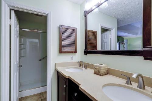 a bathroom with two sinks and a mirror at 62 Port Tack, Hilton Head Island, SC, 29928 in Hilton Head Island
