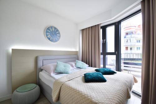 Posteľ alebo postele v izbe v ubytovaní Apartament Horyzont 101