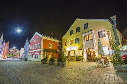 a group of buildings on a street at night at Zum Bräu-Toni in Dietfurt