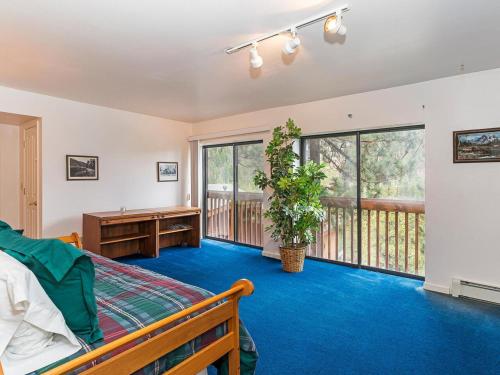 a bedroom with a bed and a balcony at 4 bedroom 3 5 bathrooms lake view condo in Incline Village