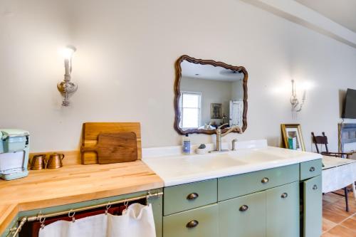 a bathroom with a sink and a mirror at New Market Apartment 6 Mi to Shenandoah Caverns! in New Market