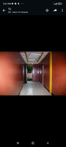 a picture of a hallway with a hallway at Hotel Divas in El Remate