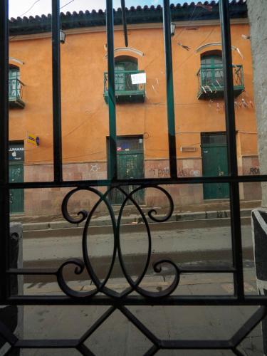a view of a building from a window at Los Faroles Hostal in Potosí