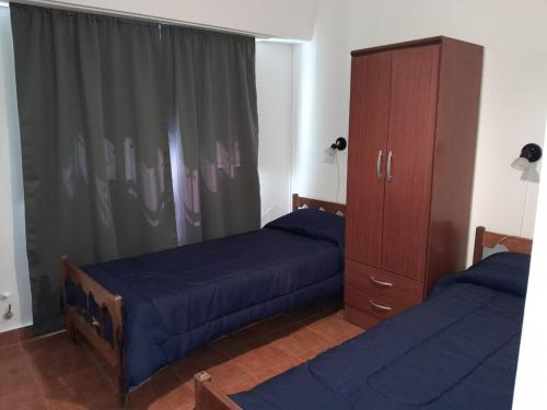 En eller flere senge i et værelse på Casa alquiler verano