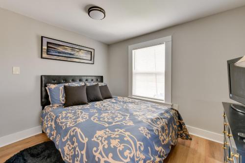 a bedroom with a bed and a window at Stunning Charlotte Retreat about 2 Mi to City Center! in Charlotte
