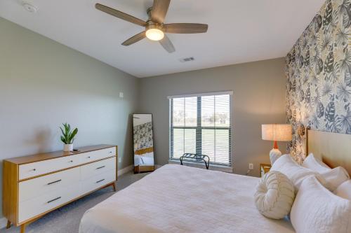 a bedroom with a bed and a ceiling fan at Texas Farmhouse on 5 Acres Patio and Grill! in Manor