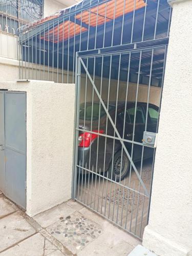 a car is parked inside of a garage at Alojamiento familiar Ñuñoa con estacionamiento a pasos del Estadio Nacional e ISP in Santiago
