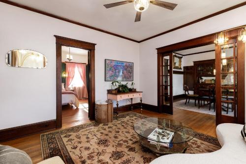 a living room with a couch and a table at The Betty - A 1920s Vintage Bungalow in Portland