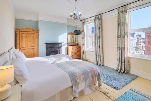 a bedroom with two beds and a window at Host & Stay - Bellevue Road in Ramsgate