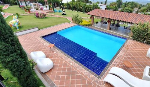 an overhead view of a swimming pool in a yard at NG Somos AT HOME Glamping a 20 min de Neiva in Neiva