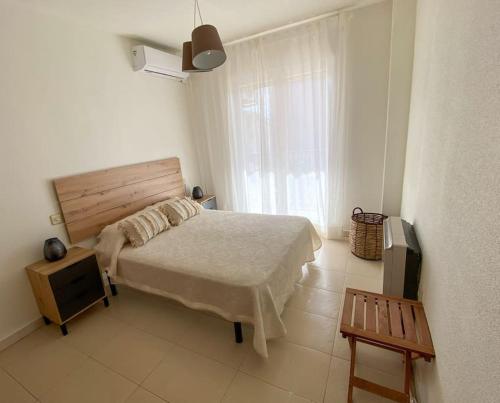 a bedroom with a large bed and a window at -.Villa Nena 2.0.- in Ledesma