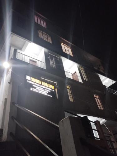 um edifício com um sinal na lateral em Yashav Homestay em Shillong