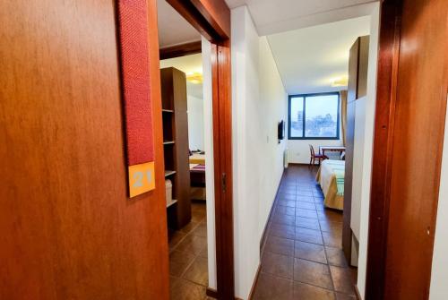 a hallway leading to a room with a bedroom at Hotel boutique Tramas Andinas in Salta