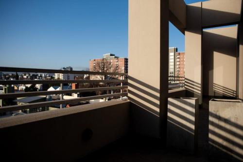 a balcony of a building with a view of the city at Hotel boutique Tramas Andinas in Salta