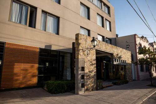 a building with a door on the side of it at Hotel boutique Tramas Andinas in Salta