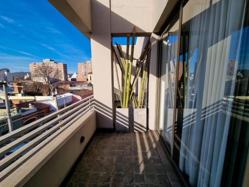 a balcony with a view of a city at Hotel boutique Tramas Andinas in Salta