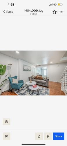 a living room with a couch and a table at Del Mar pool Home in Fresno