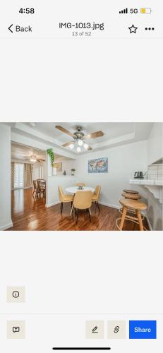 a room with a table and chairs and a dining room at Del Mar pool Home in Fresno