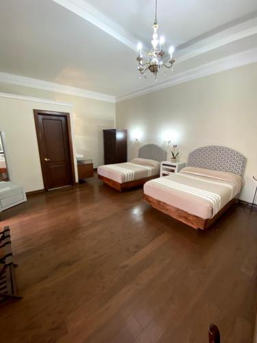 Hotel Cantera Real, Moreliaにあるベッド