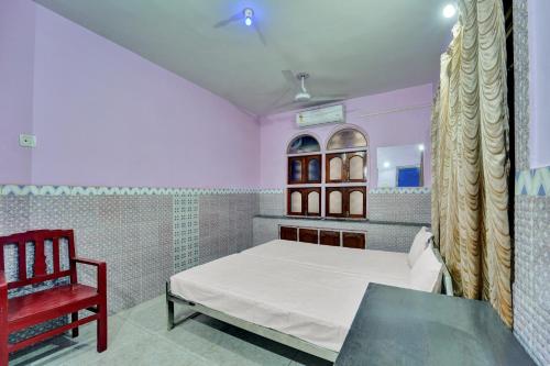 Ένα ή περισσότερα κρεβάτια σε δωμάτιο στο HOTEL O GURU NANAK RESIDENCY