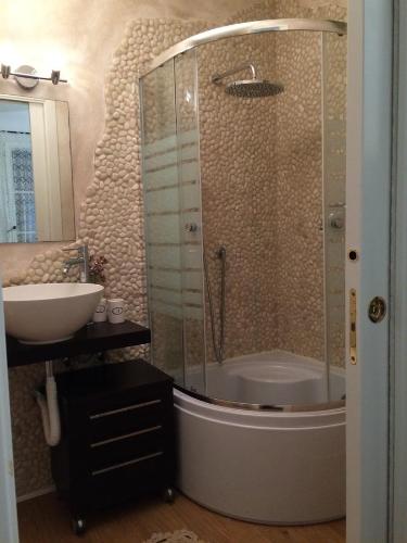 a bathroom with a shower and a sink at Casina Rosa in Certaldo