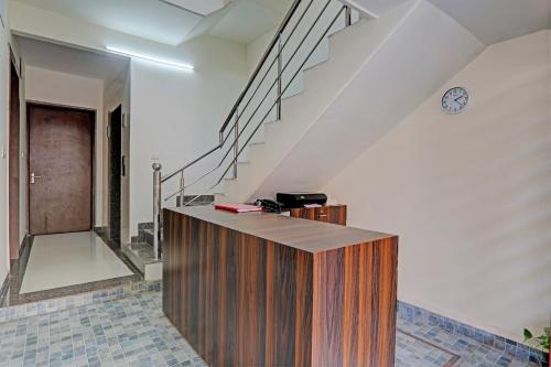 a staircase with a wooden counter in a room at The Bunglo (Villa) in Allahābād