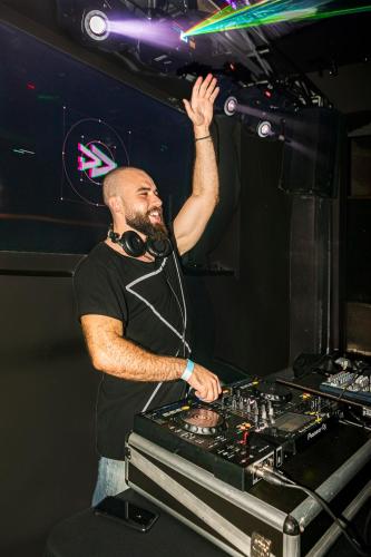 a man standing in front of a dj booth at RioZin Pousada Liberal - Somente Adultos - Clothing Optional - Lifestyle Hotel in Rio de Janeiro