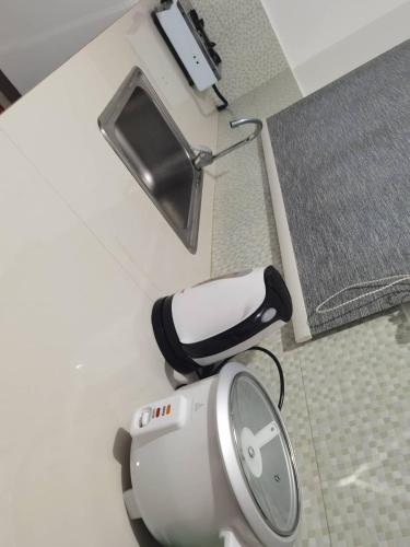 an overhead view of a hair dryer in a bathroom at Casa Kristar in Mamburao