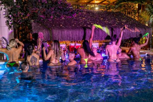 a group of people in a swimming pool at RioZin Pousada Liberal - Somente Adultos - Clothing Optional - Lifestyle Hotel in Rio de Janeiro