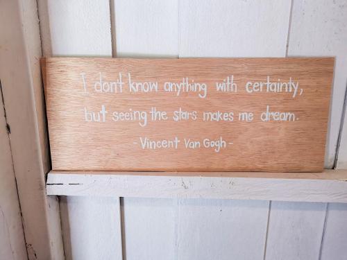 a sign on a wall with a poem on it at Panakluea at Kokuang Homestay in Ban Na Lae