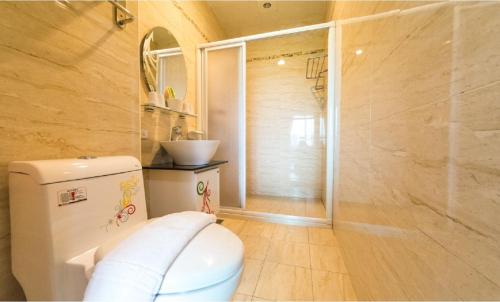 a bathroom with a toilet and a sink at D3 Classic BNB in Wujie