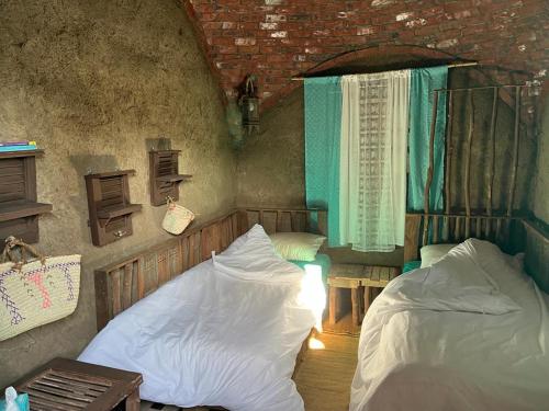 Tempat tidur dalam kamar di Nassimah