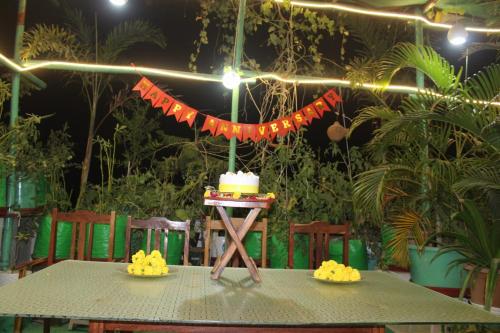 a table with a cake on top of it at CHOUDHARY WHITE HOUSE Udaipur in Udaipur