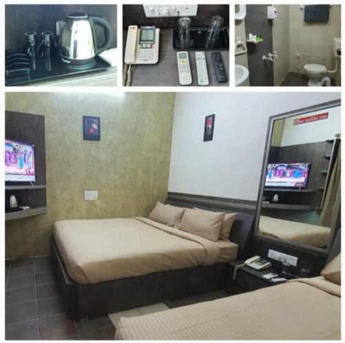a hotel room with a bed and a television at Hotel Sapthagiri Nest in Coimbatore