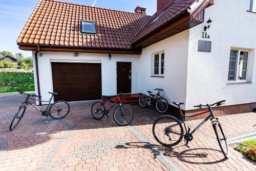 a group of bikes parked outside of a house at Chill Warmia in Dywity