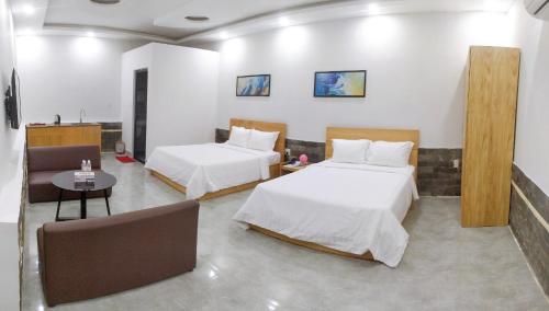 Postel nebo postele na pokoji v ubytování Khách sạn Khang Điền 2