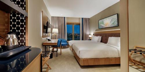 a hotel room with a bed and a desk at DoubleTree by Hilton Hotel Istanbul - Tuzla in Istanbul