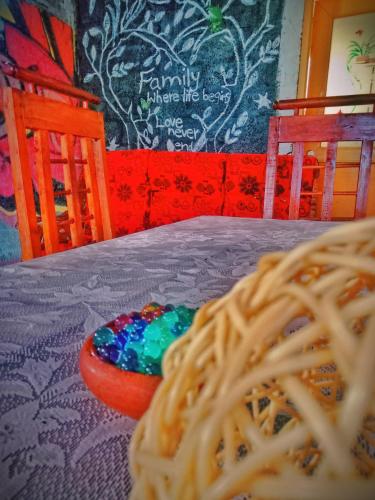 a table with a plate of spaghetti on a table at Sandaru Surffing Inn in Weligama