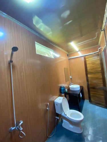 a bathroom with a toilet and a sink at Thai Hai Village - Bản làng Thái Hải 