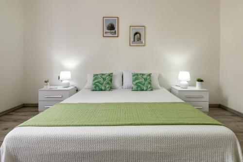 Un pat sau paturi într-o cameră la Casa Belvedere